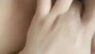 Naked Indian holds camera with one hand and fingers XXX hole with another