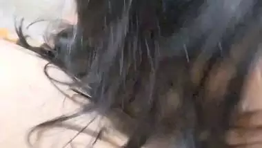 GF with smiling face gives blowjob to boyfriend