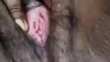 Young village girl spreads legs to rub virgin Desi bush in XXX video