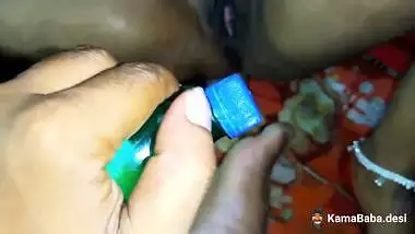 A village lady stuffs pussy with bottles in a desi sex video