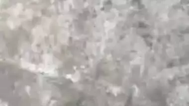 MILF dries hair and body outdoors being filmed by an Indian perv