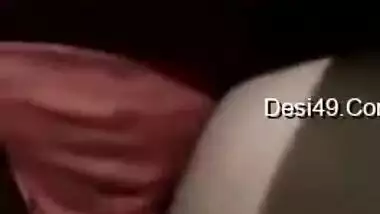 Desi brunette XXX strips to show her huge tits and fluffy pussy
