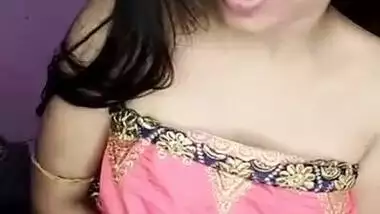 Desi Bhabhi takes boobies to light next to her XXX partner in bed