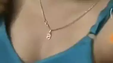 Girl with Indian features takes bra off exposing her boobs in sex show