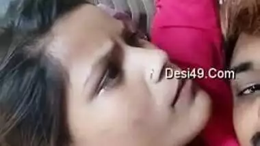Young Desi woman is lying in bed with XXX lover kissing her on camera