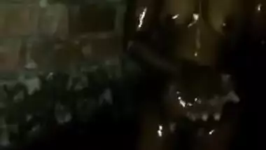 Indian woman washes XXX curves while hubby decides to film sex clip