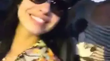 Two hot babes flash there boobs and kiss each other in moving ca