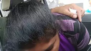 Telugu woman gives a desi blowjob to her man in a car