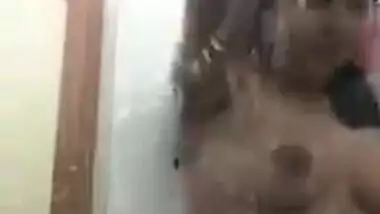 Pretty Desi chick with natural XXX boobs seductively washes herself