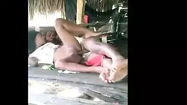 Young couple enjoy outdoor sex in a tent house on the beach