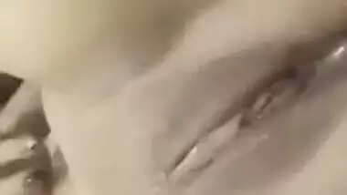 Relaxed Desi gal touches own XXX boobs and sweet vagina on camera