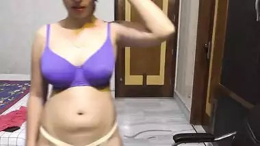 Chick doesn't hurry to take off purple bra teasing Indian porn lovers