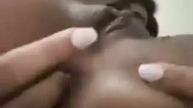 An Indian nude girl fingers her shaved pussy and ass