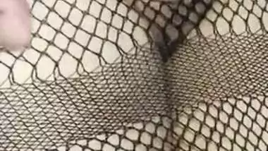 Hot Desi babe in fishnet dress has her pussy XXX rubbed by lover