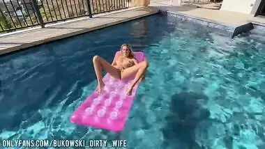 A beautiful blonde masturbates in the pool and lures a peeping guy into a blowjob